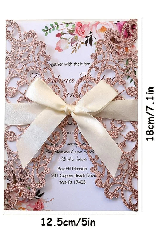 Lace wedding invitation with a bow and floral design, shown with measurements.