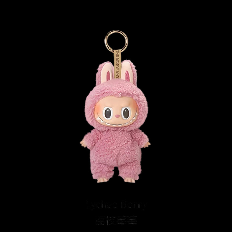 Pink plush keychain with a gold tag on a white background