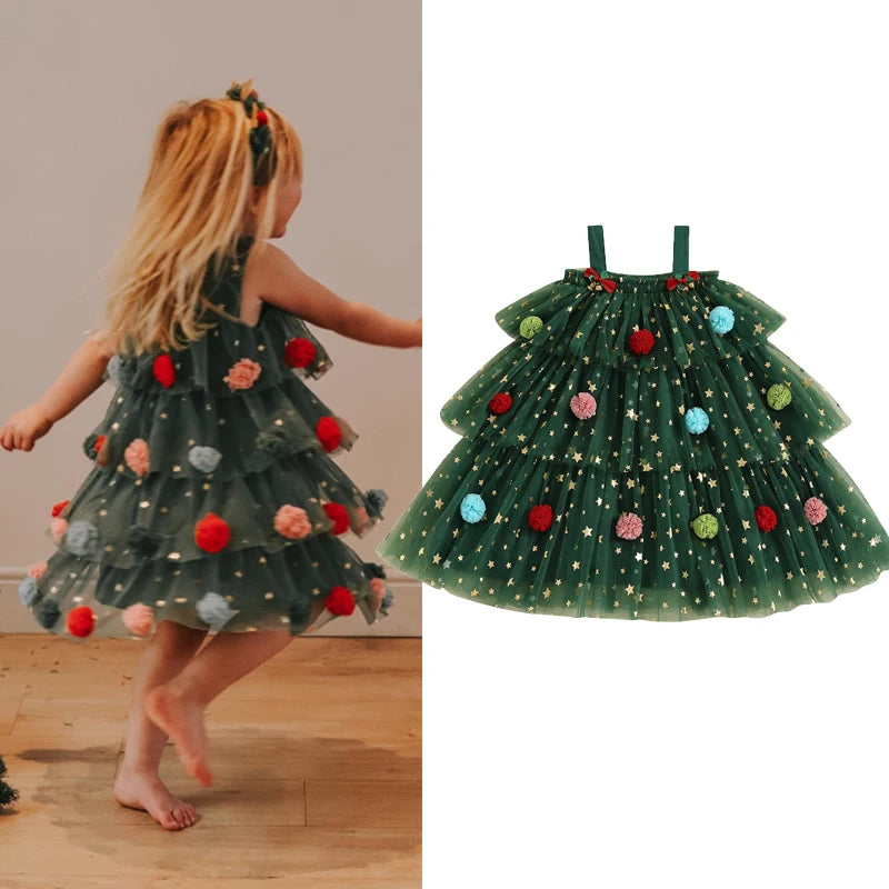 Child wearing a green dress designed like a Christmas tree with colorful decorations, next to an inset showing the dress details.