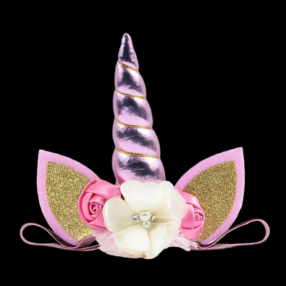 Unicorn headband with pink and gold accents on a white background