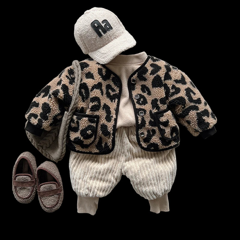 Children's outfit with leopard print jacket, white pants, and cap on a white surface