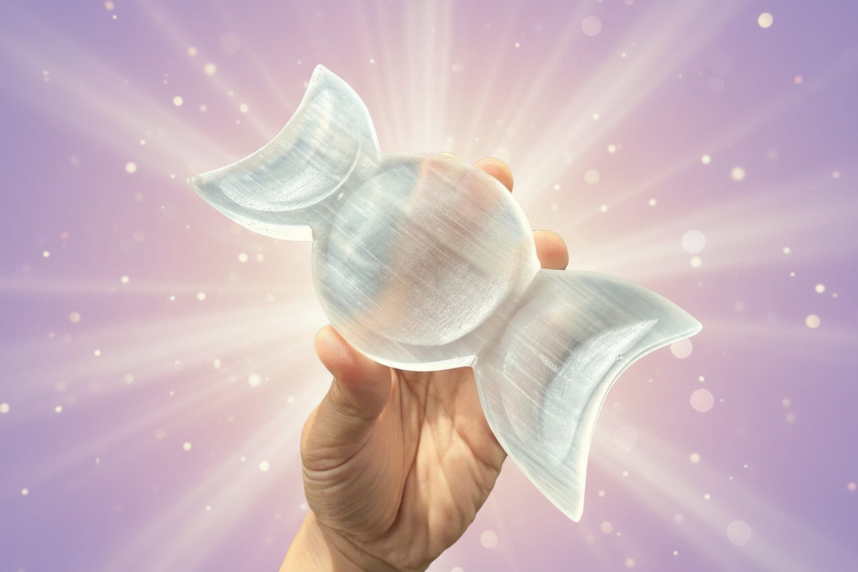 Clear silicone bra cup held by a hand with a blurred background