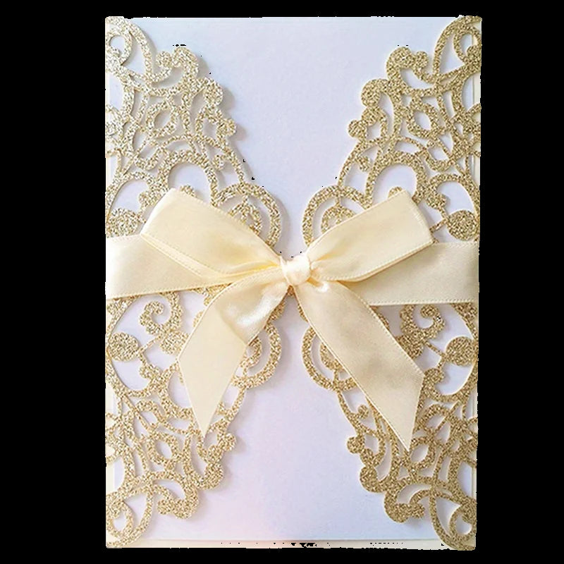 Decorative card with gold lace design and a cream ribbon on a white background