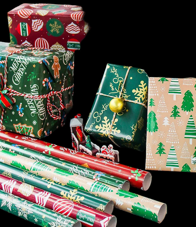 Christmas presents and wrapping paper with a decorated tree in the background
