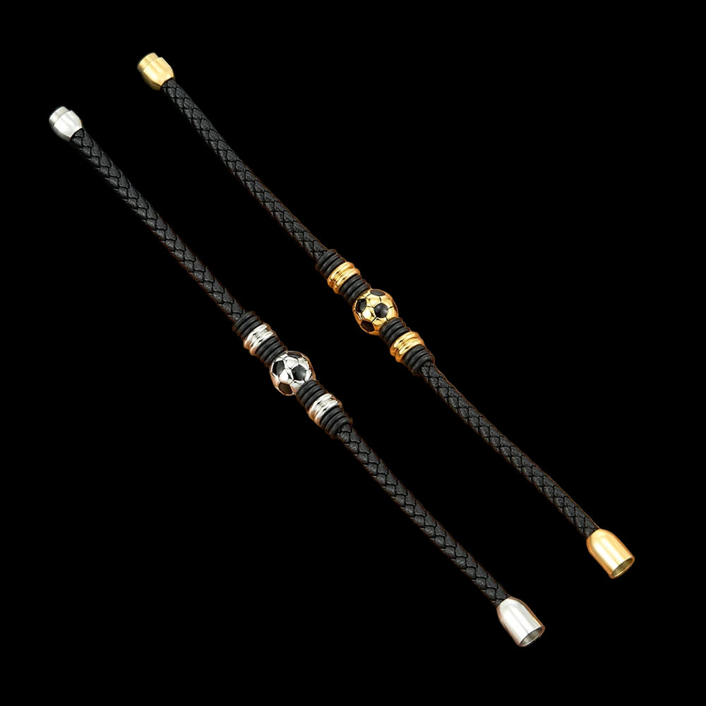 Black braided lanyards with gold and silver beads on a wooden surface