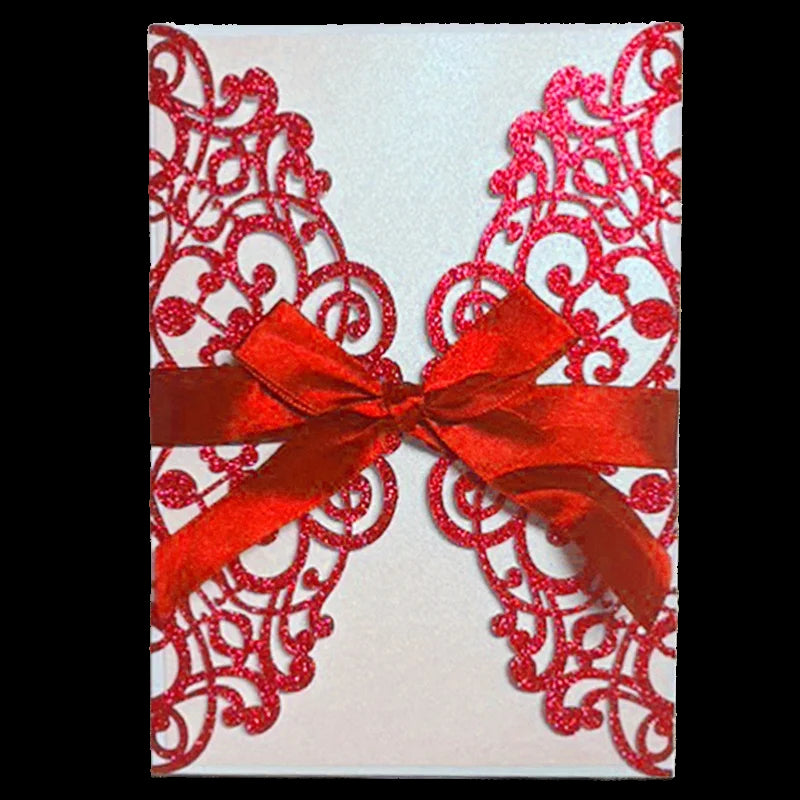 Decorative card with red lace design and a red ribbon on a white background