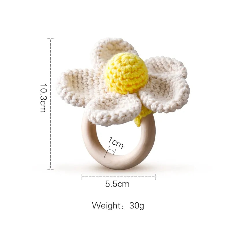 Crocheted flower ring with measurements and weight on a white background