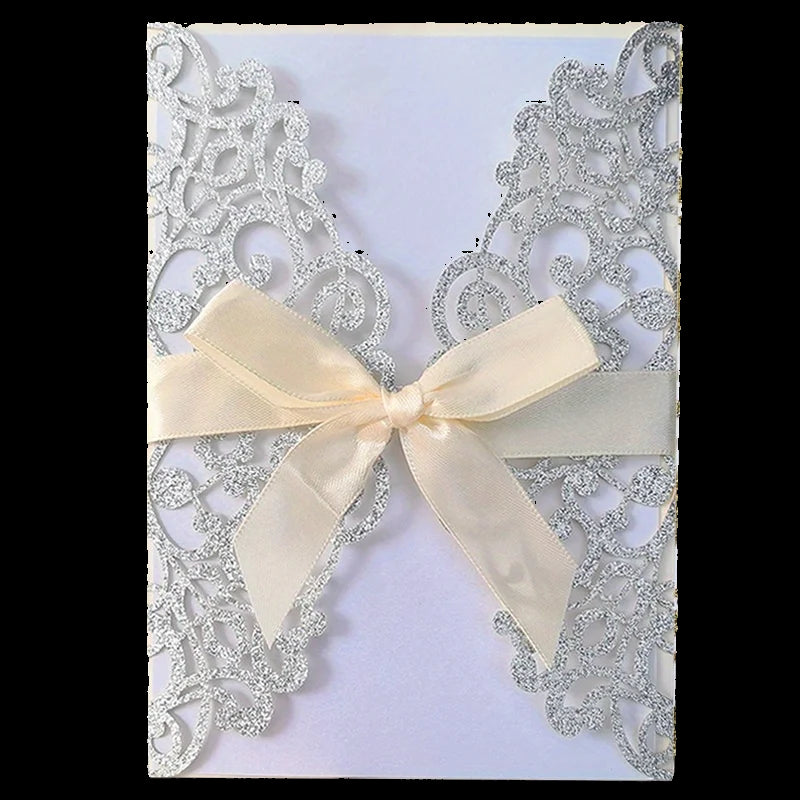Decorative card with lace detailing and a cream bow on a white background
