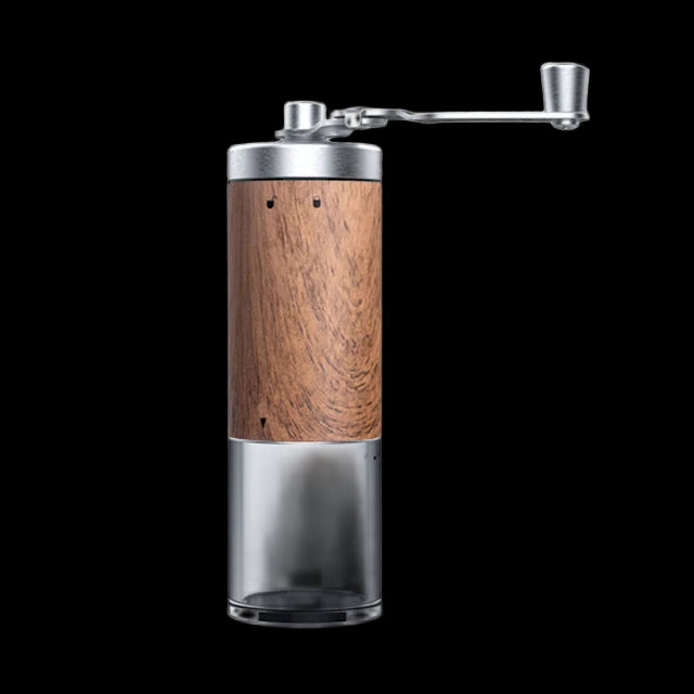 Wooden and glass manual coffee grinder on a white background