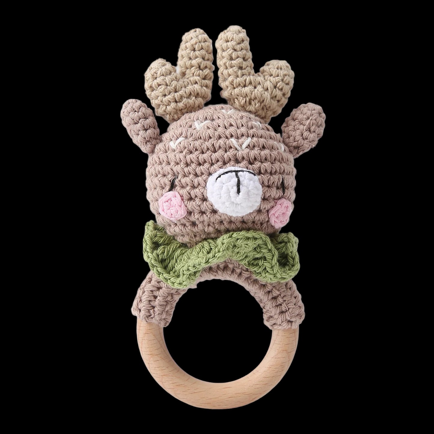 Crocheted reindeer rattle with wooden ring on a white background