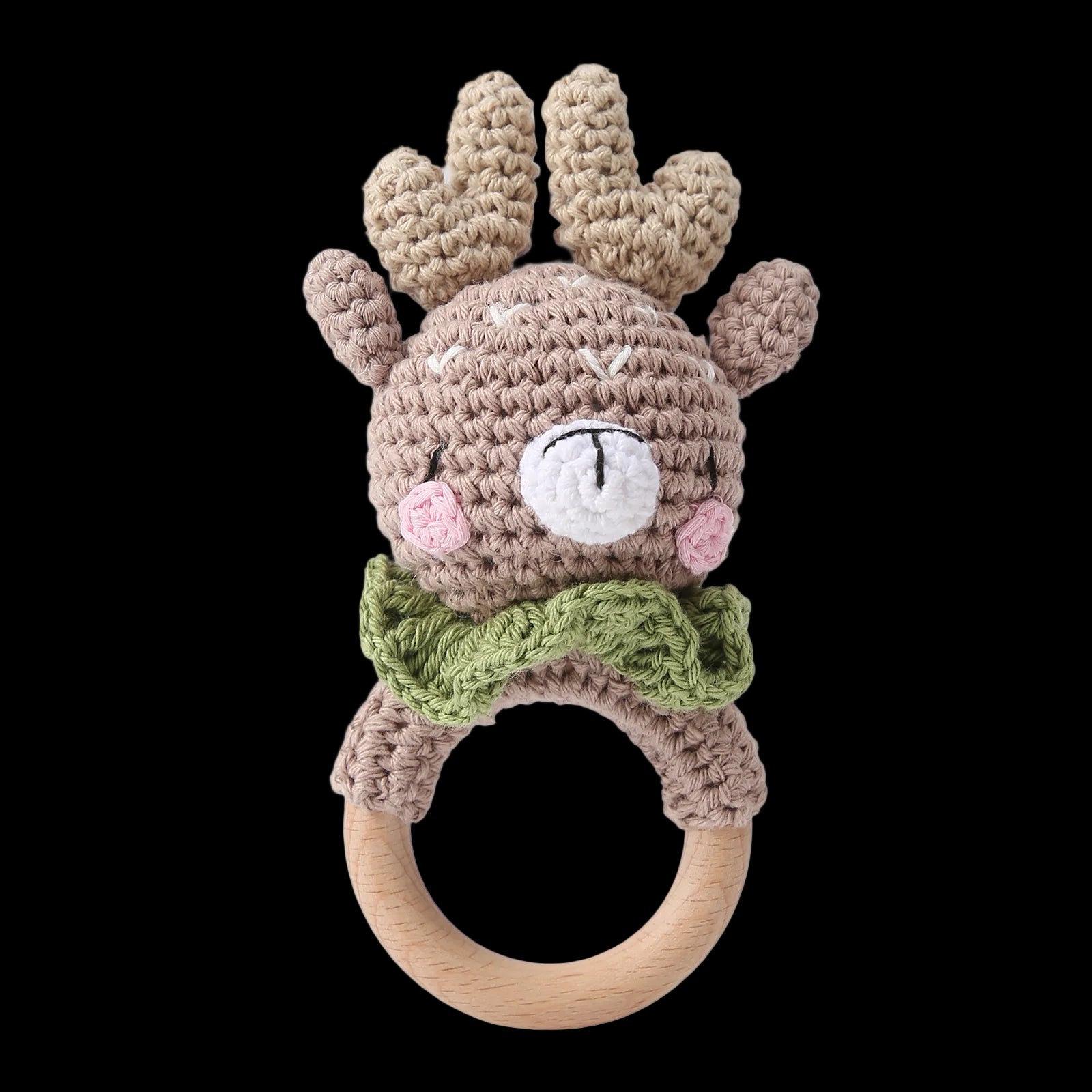 Crocheted reindeer rattle with wooden ring on a white background