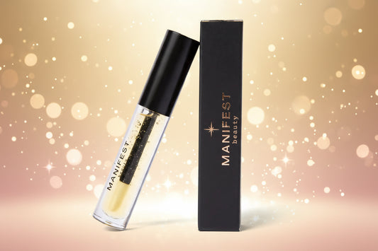 Manifest beauty lip gloss with black cap and packaging on a white background
