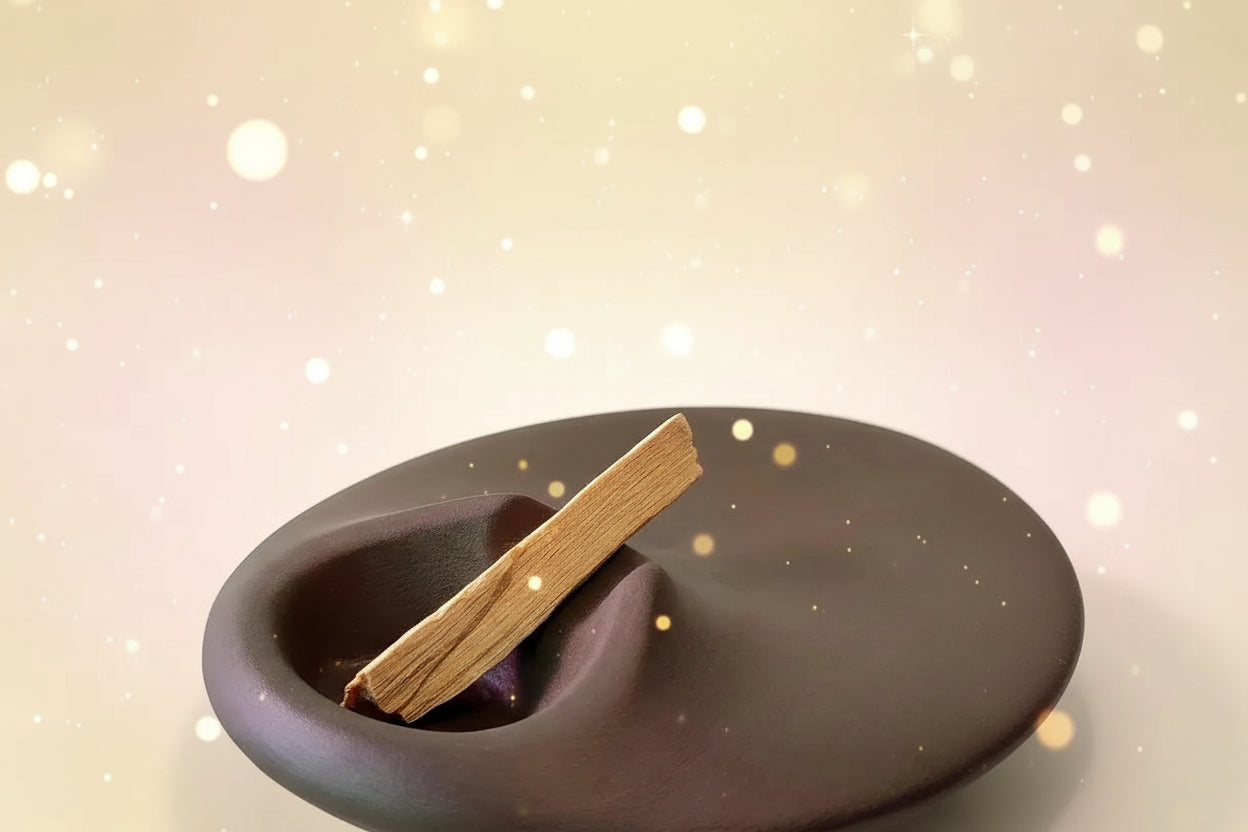 Brown ceramic dish with a wooden stick on a white background