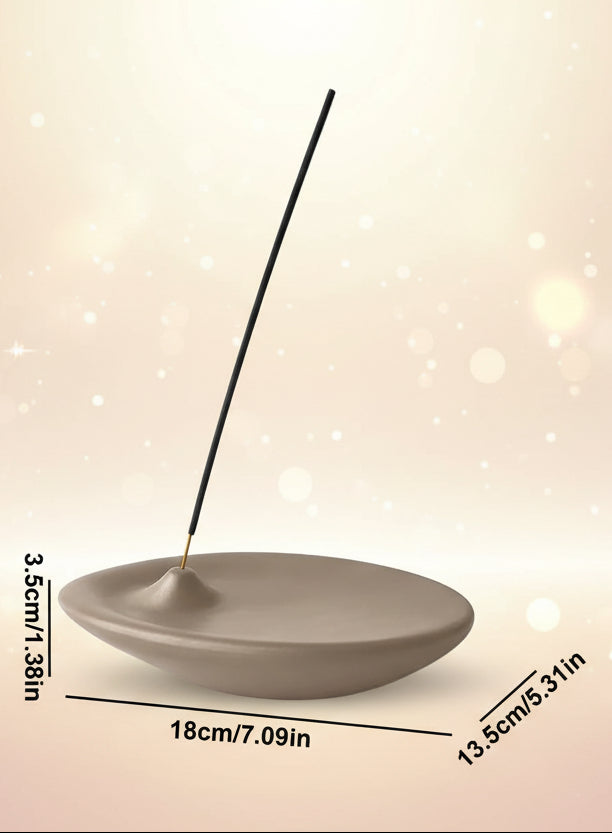 Ceramic incense holder with a single incense stick, showing dimensions on a white background.