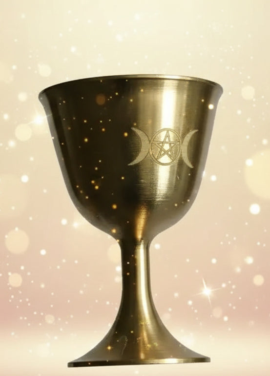 Gold chalice with a symbol on a gray background