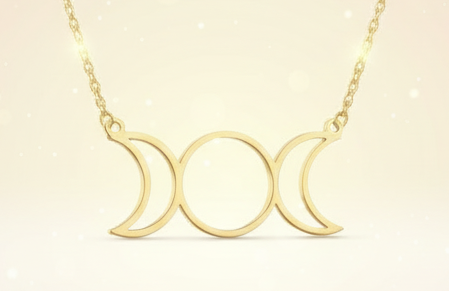 Gold necklace with a triple moon symbol and measurements on a white background