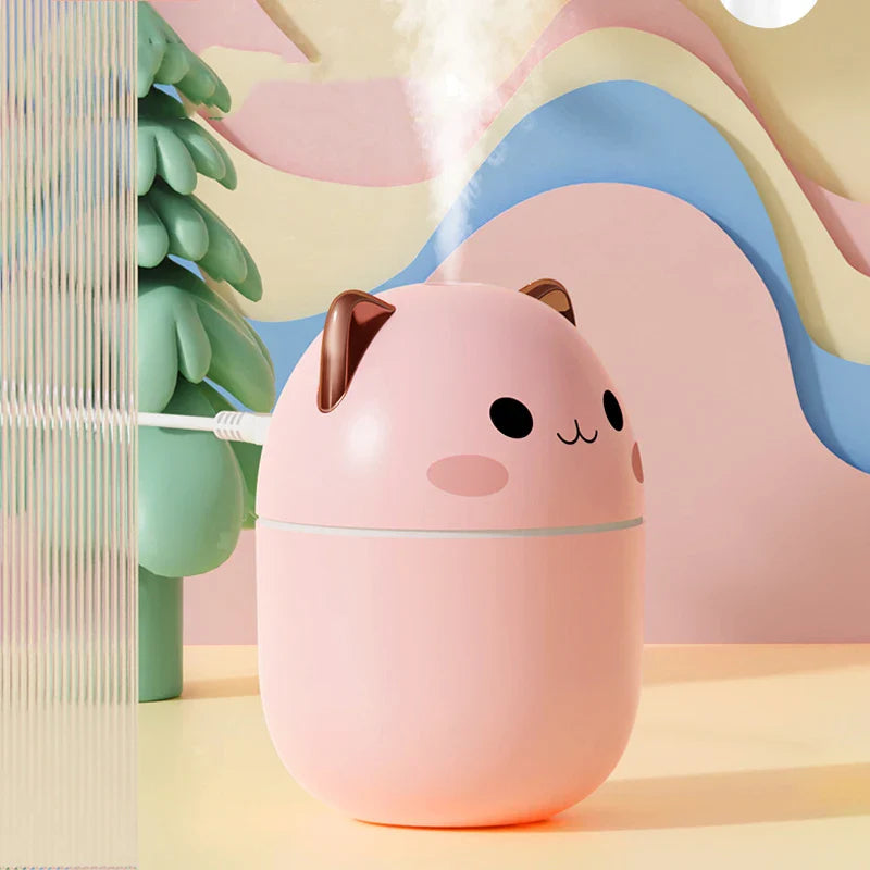 Pink cartoon-style humidifier with a cute face on a colorful background