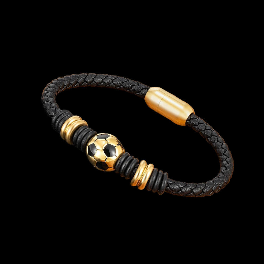 Black braided bracelet with gold accents on a wooden surface