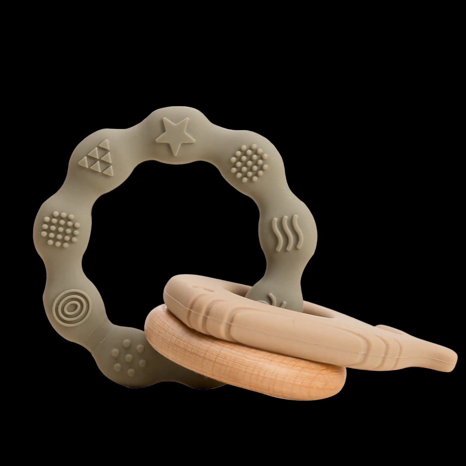 Teething ring with textured surface and wooden elements on a white background