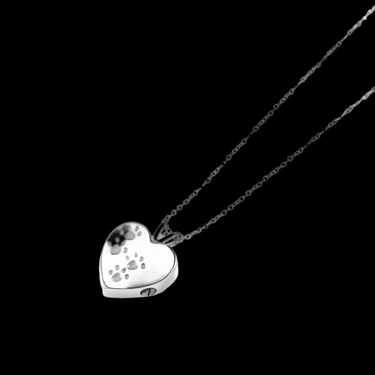 Silver heart-shaped pendant necklace on a white background