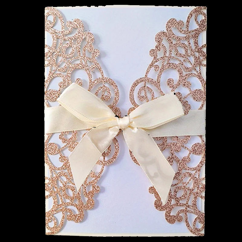 Decorative card with rose gold lace design and a cream bow on a white background
