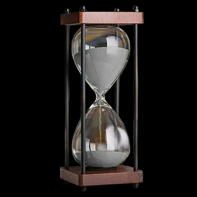 Hourglass on a desk with a blurred background