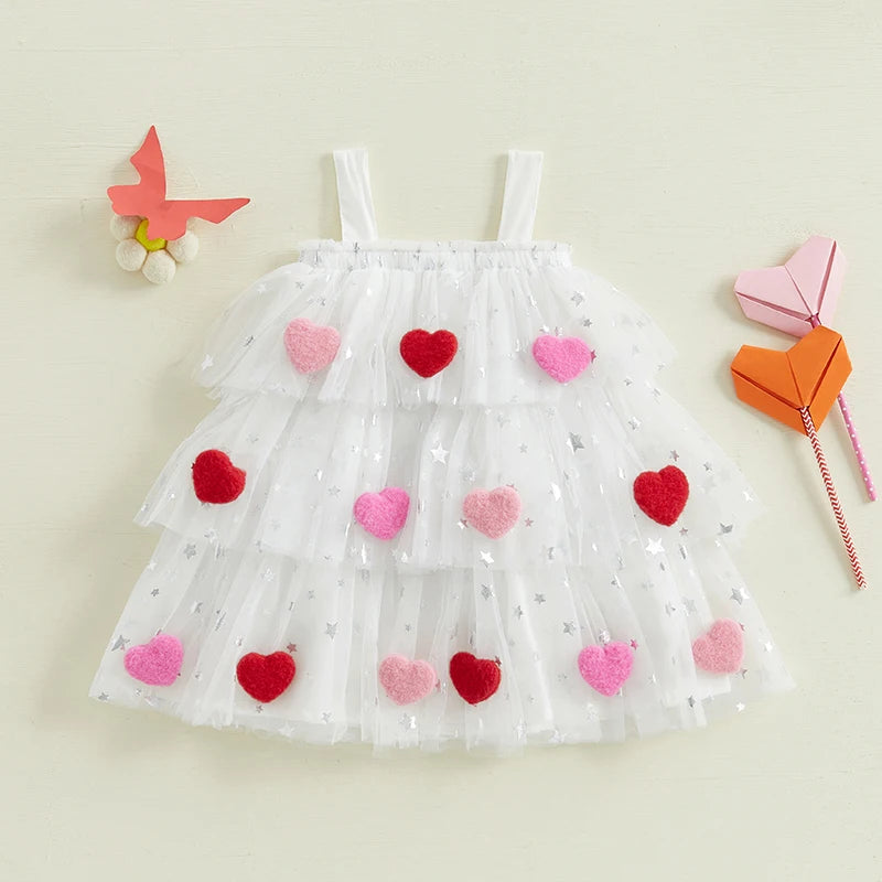 White dress with red and pink heart patterns on a beige background