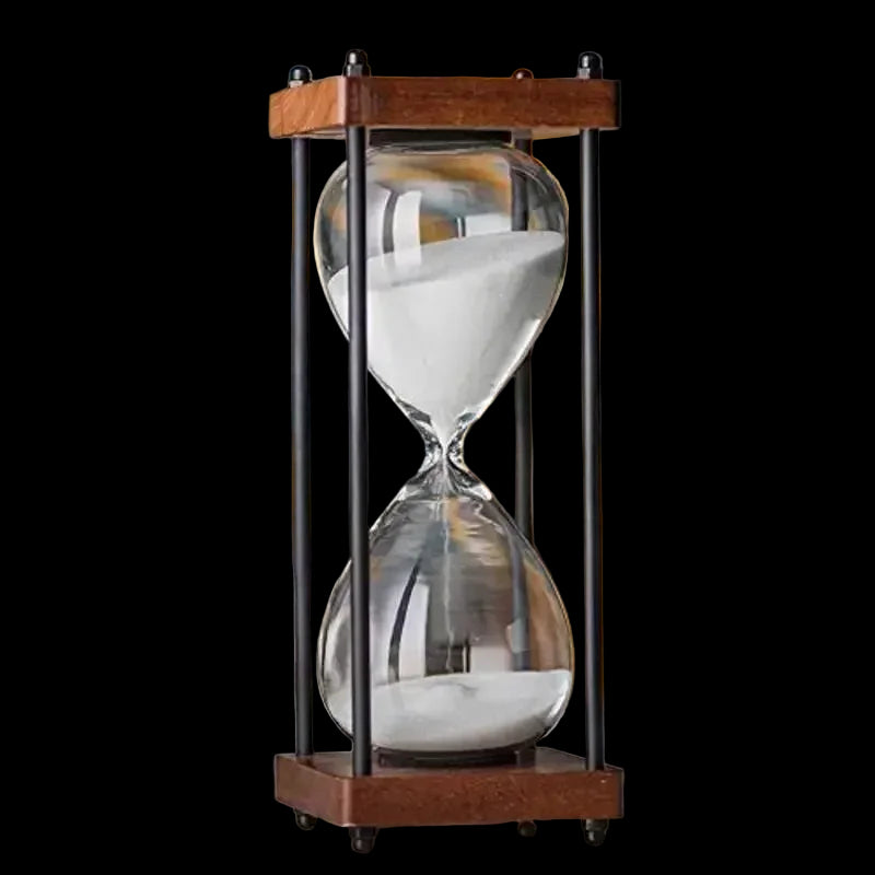 Hourglass on a desk with a blurred background