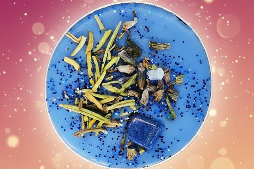 Blue plate with dried herbs and spices on a gradient pink to orange background