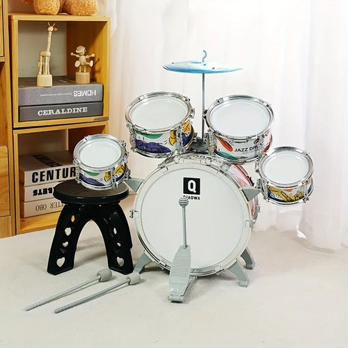 Miniature drum set with drums and stands on a light surface.