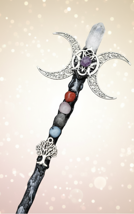 Decorative staff with star-shaped top and beaded handle on a dark blue background