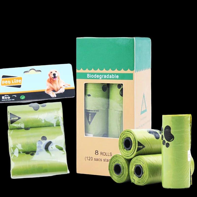 Green biodegradable dog waste bags with packaging on a white background