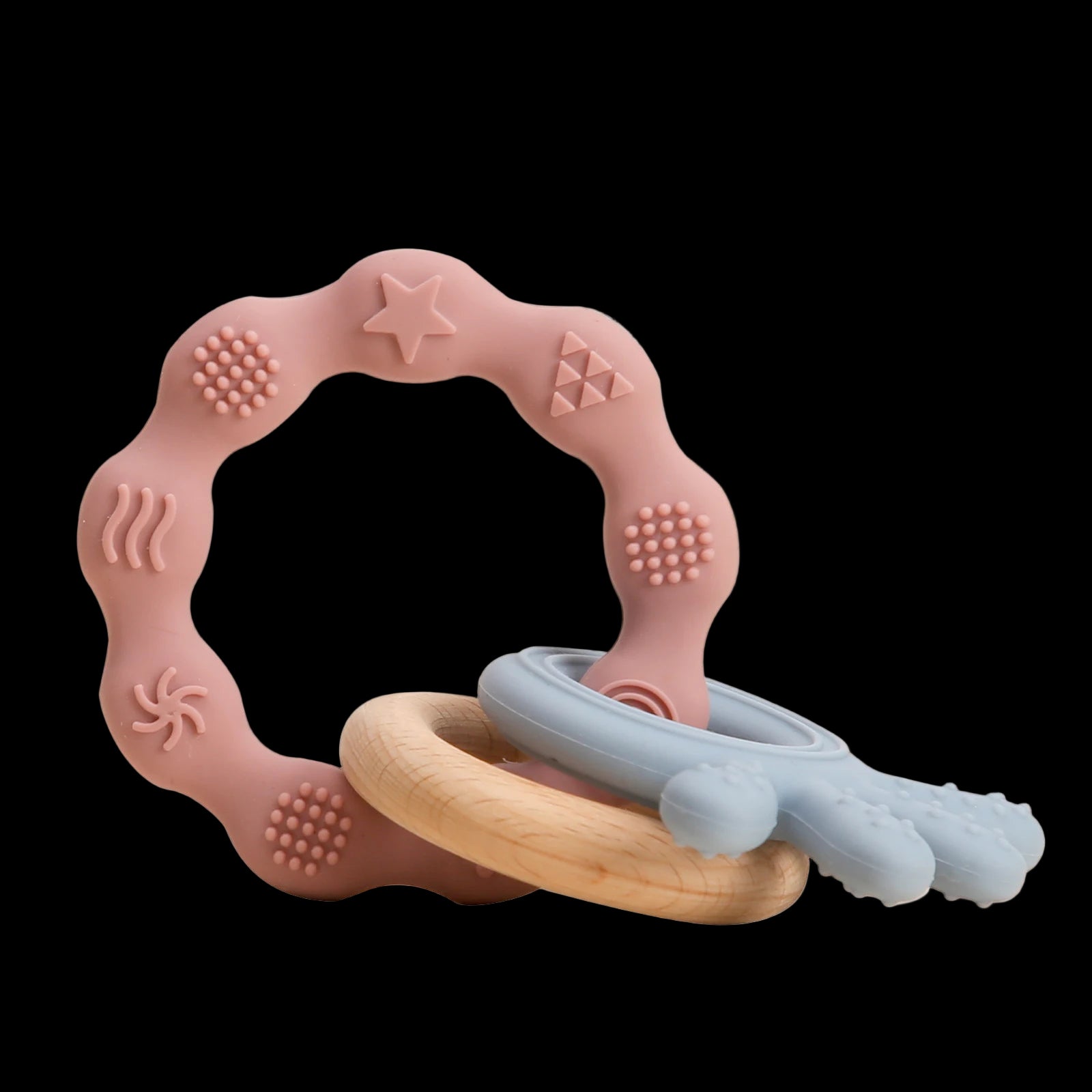 Pink silicone teething ring with wooden and rubber components on a white background
