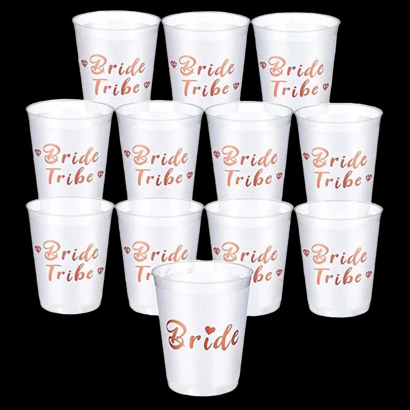 Set of white cups with 'Bride Tribe' and 'Bride' text in rose gold on a white background.