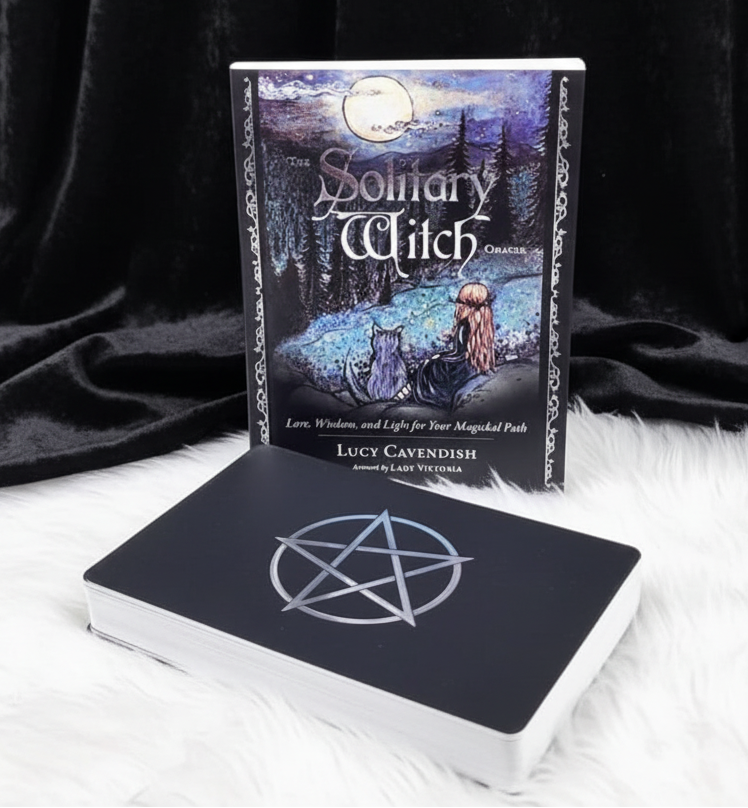 Book titled 'The Solitary Witch' by Lucy Cavendish on a white surface with a forest background.