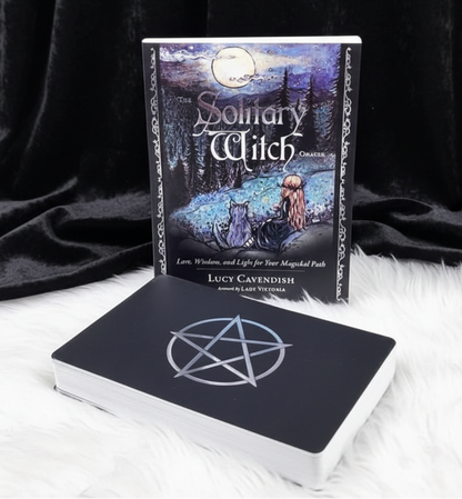 Book titled 'The Solitary Witch' by Lucy Cavendish on a white surface with a forest background.