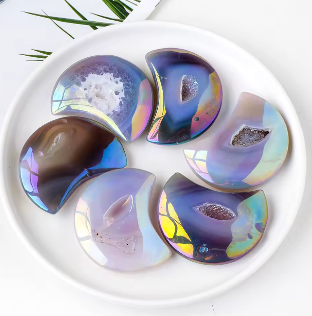 Set of colorful, semi-precious stones on a white plate with a white background