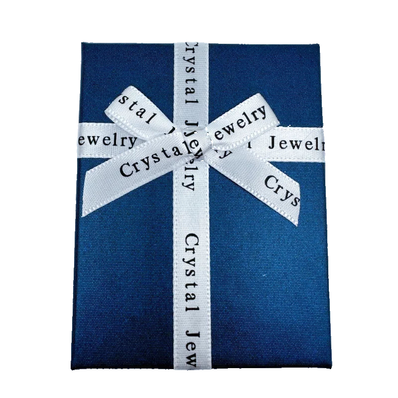Blue jewelry box with a white ribbon and 'Crystal Jewelry' text on a white background