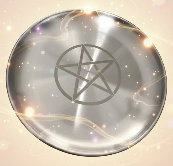 Metallic plate with a pentagram symbol on a plain background