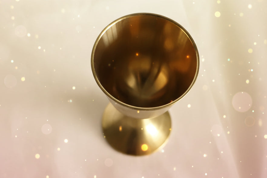 Gold candle holder on a white background