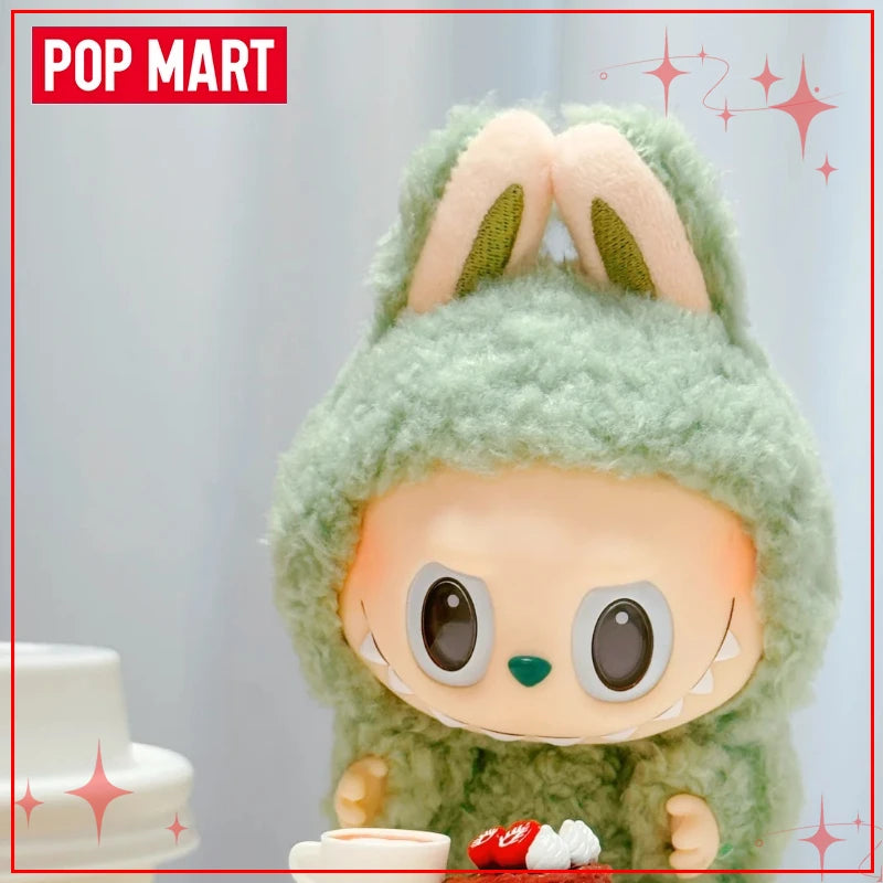 Toy figure with green fuzzy hair and bunny ears, sitting on a white surface with 'Pop Mart' branding.