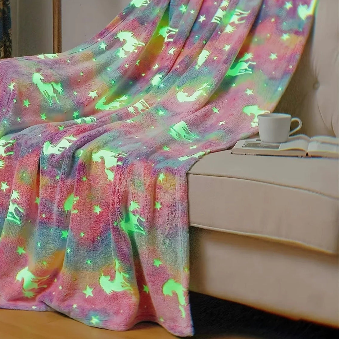 Glowing multicolored blanket with animal patterns draped over a couch in a room.