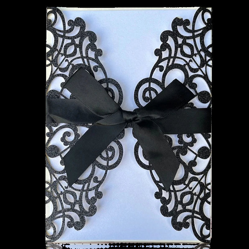 Lace invitation card with a black ribbon on a white background