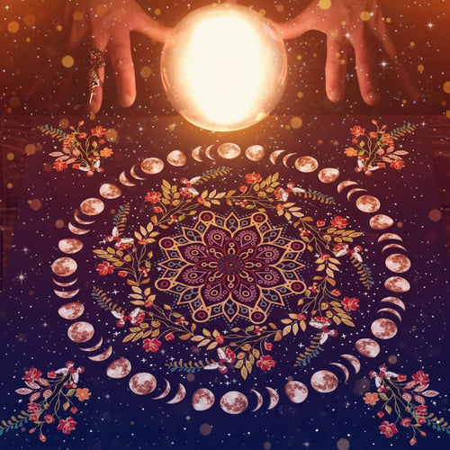 Mandala design with moon phases and hands holding a glowing crystal ball on a dark background