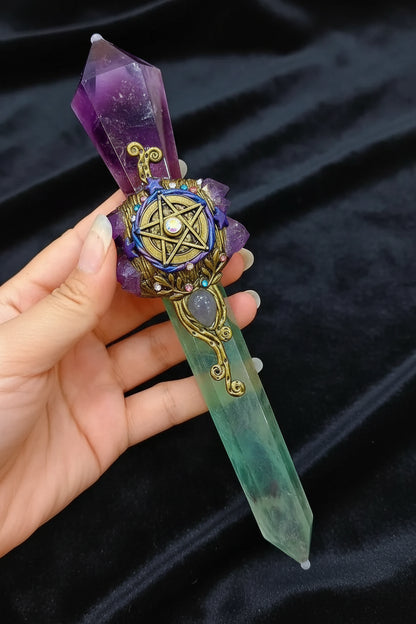 Decorative crystal with intricate design held over a magazine