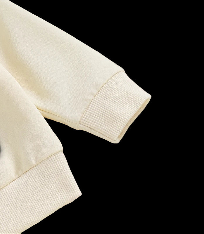 Close-up of a beige fabric with a textured edge on a light background