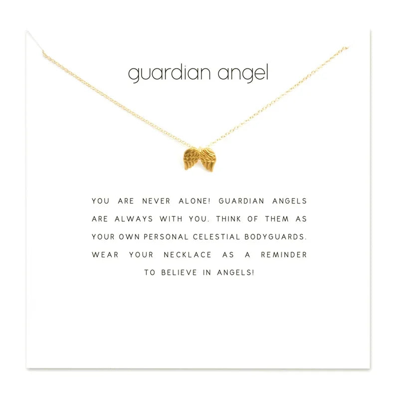Gold necklace with a small heart pendant on a white card with text.
