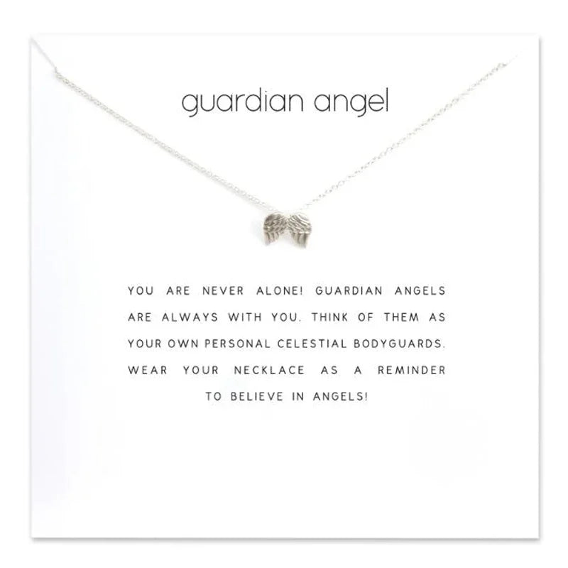 Silver 'guardian angel' necklace on a white card with text.