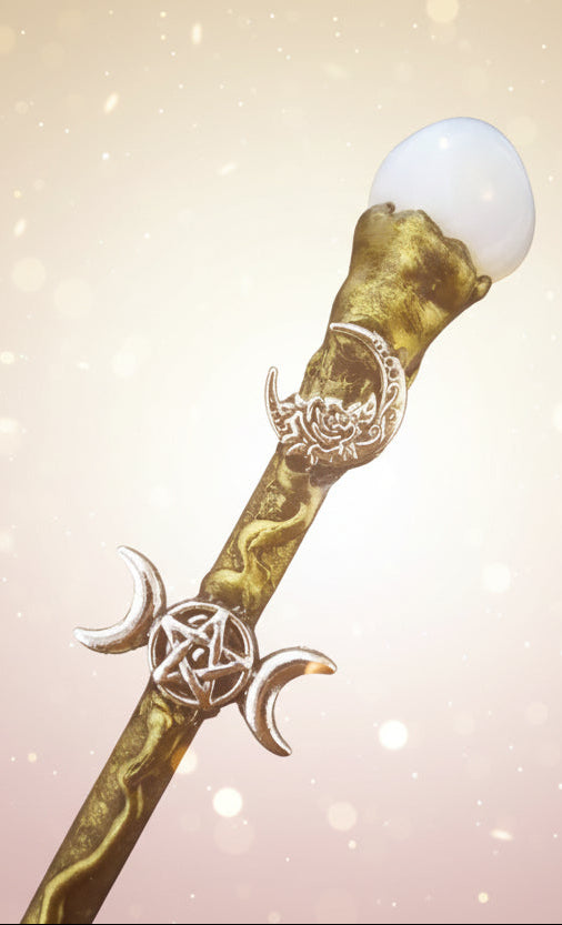 Decorative staff with mystical symbols on a dark background