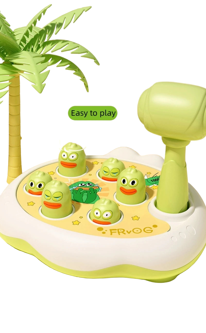 Children's educational toy with green frogs and a handle on a beach-themed background